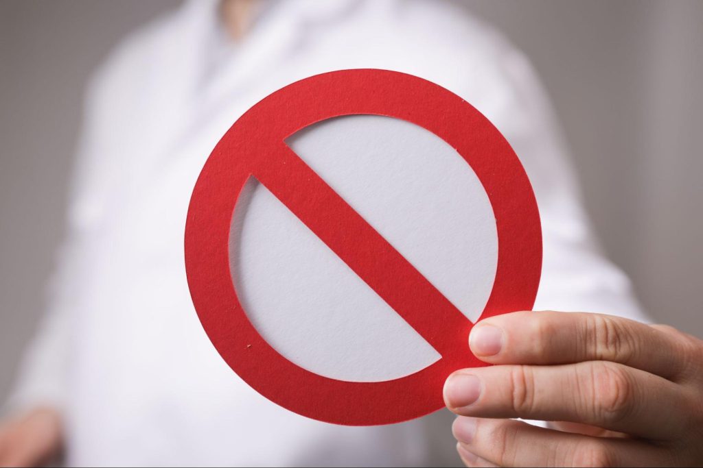 Man holding a stop sign. 